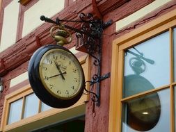 clock on the facade of the building