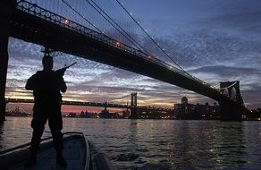 military silhouette on the background of the Brooklyn bridge