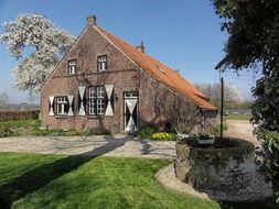 brick house with red tile roof, netherlands, oostrum