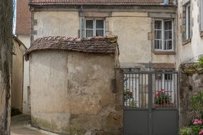 closed gate to courtyard of Old house