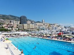 panoramic view of a large blue outdoor pool in monaco