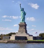 statue of liberty among the water on manhattan