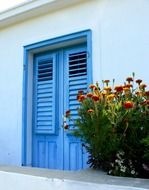 blue doors with shutters in a building on the Adriatic