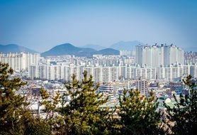 cityscape buildings blocks Mountains aback