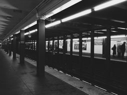 black and white photo of a metro station