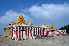 ancient temple building with red and white stripes