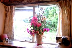 flowers vase on the window