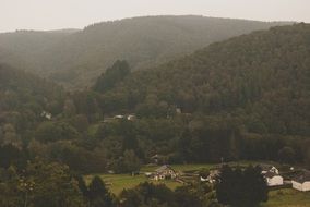 panoramic view of a mountain village in the fog