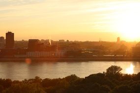 Amazing sunset sky river buildings