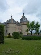 castle in belgium near green meadow