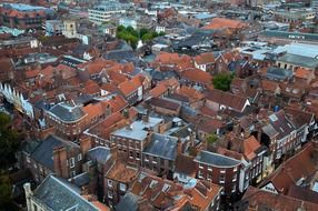 A bird's eye view of the roofs of city houses