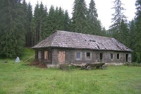 old wooden house in a forest in Romania