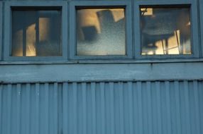 stolen windows in a metal hangar