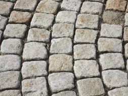 pavers on the road are lined with a pattern
