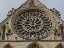 gothic york minster, rosette at facade, york, uk,