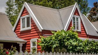 building with red walls near green trees