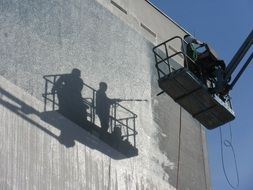 high-rise workers on the facade of a building