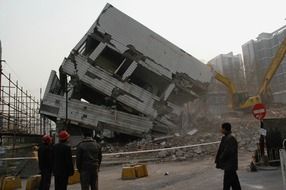 demolition of building by bulldozer