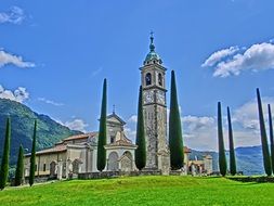 Amazing church with clock tower in the green valley