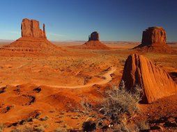 red sandstone rock formations in desert at evening, usa, colorado, arizona, monument valley