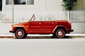 red vintage convertible on the street