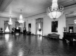1952 black and white photo of the east room in the White House, Washington
