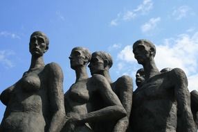 memorial statues to the holocaust under the blue sky
