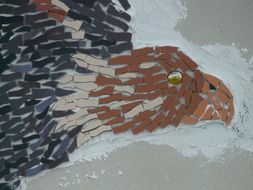 adler, bird head, colorful mosaic on wall