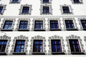 Facade of a white building with flat windows