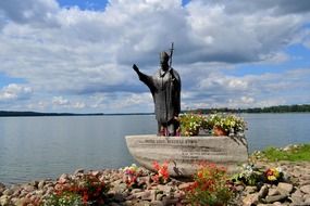 monument to Pope John Paul II at river, poland, czaplinek