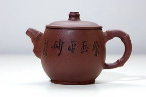 brown china teapot at table