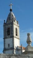 bell tower on a church building on a background of blue sky