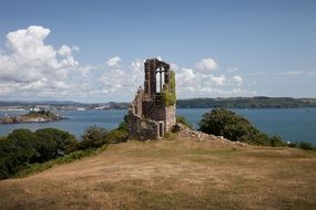 landscape of ruins by a river