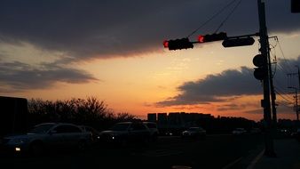 traffic near the traffic lights at sunset