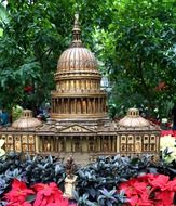 model of capitol building in garden on flower bed