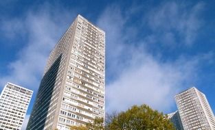 skyscrapers under white clouds in paris