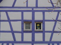 blue farm building with small windows