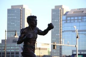 metal statue boxer city backgraund