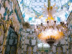 room with a large chandelier in the palace