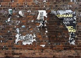 brick wall with old posters