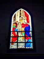 stained glass window with saints