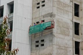 workers man on building