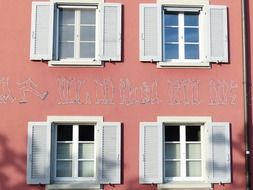 old house with a pink facade