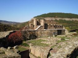 panoramic view of the ruins of a medieval fortress on a sunny day
