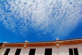 blue sky over a building in the city of malacca