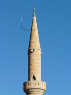 Tower minaret on the sky background