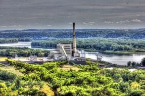 factory at river in forest