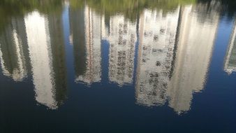 reflection of skyscrapers in a lake