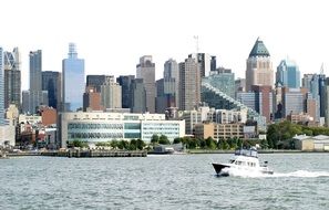 motor boat speeding in front of city at summer, usa, nyc