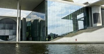 glass building near the river in berlin